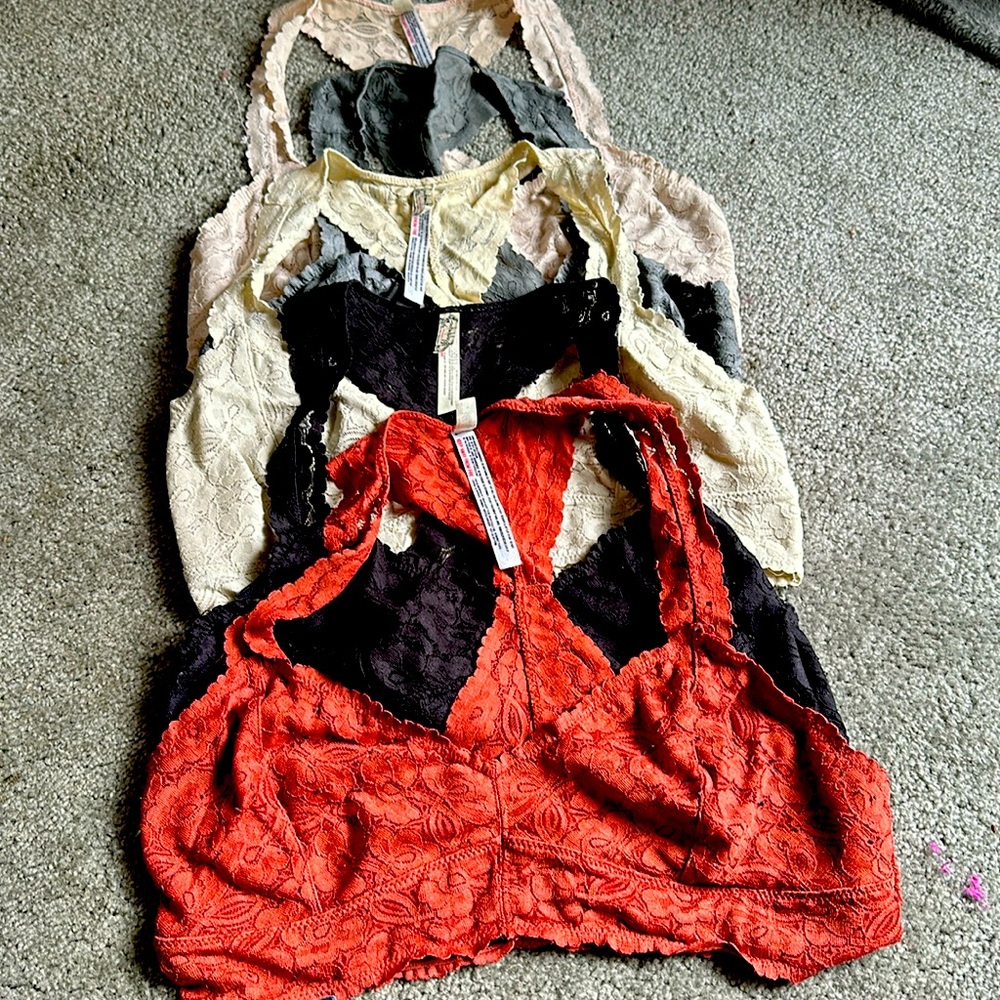 Five free people lace bras, size large- in pink, ivory, rust, black and gray